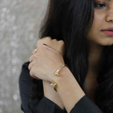 Model Wearing Beautiful Solid Gold Greek Column Bangle by Jewelry Lane